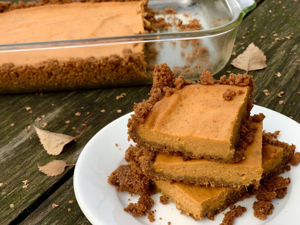 A stack of pumpkin pie bars on a plate